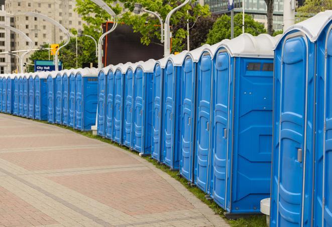 a line of brightly-colored portable restrooms, perfect for outdoor festivals and concerts in Crossville AL